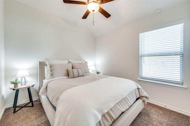 carpeted bedroom with ceiling fan and lofted ceiling