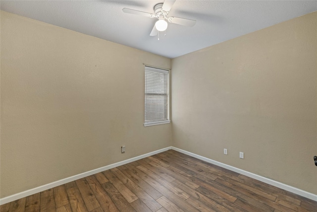 unfurnished room featuring ceiling fan and dark hardwood / wood-style floors