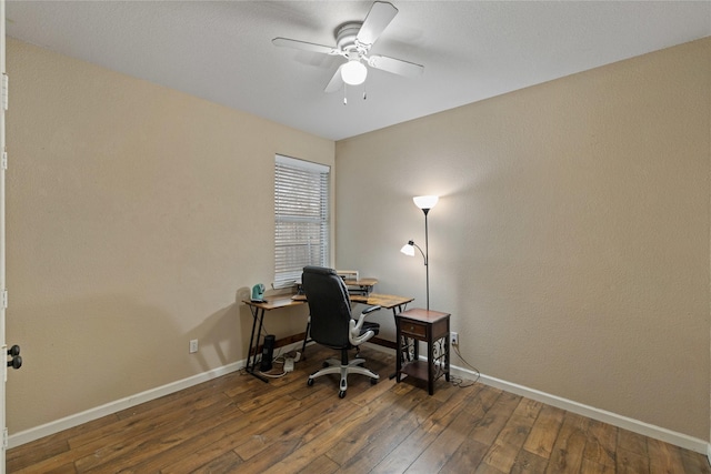 office featuring dark wood-type flooring and ceiling fan