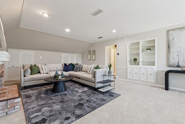 living room featuring built in features, vaulted ceiling, and carpet floors