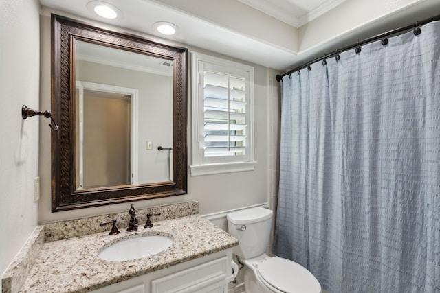 bathroom with toilet, a shower with shower curtain, vanity, and crown molding