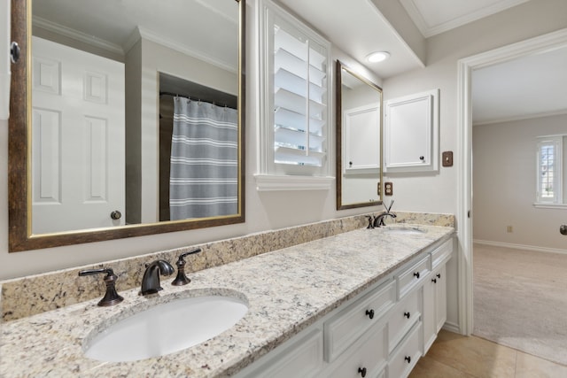 bathroom featuring tile patterned floors, crown molding, and vanity