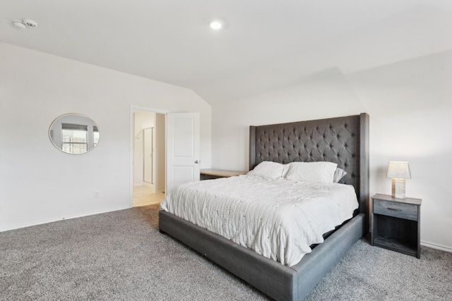 carpeted bedroom featuring vaulted ceiling