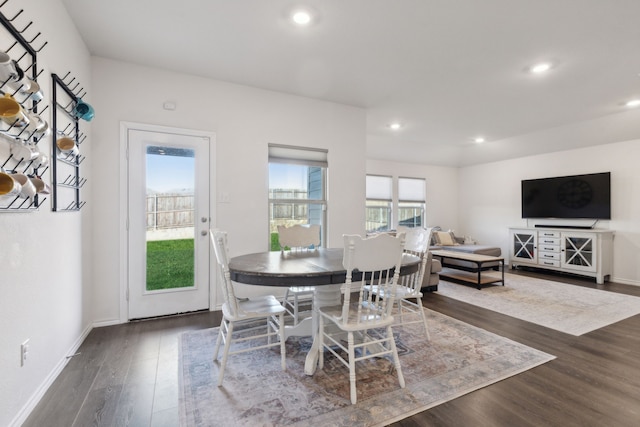 dining area with dark wood-type flooring