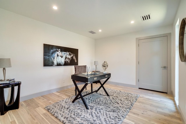 office with light hardwood / wood-style floors