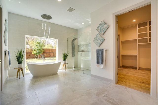 bathroom with a wealth of natural light and plus walk in shower