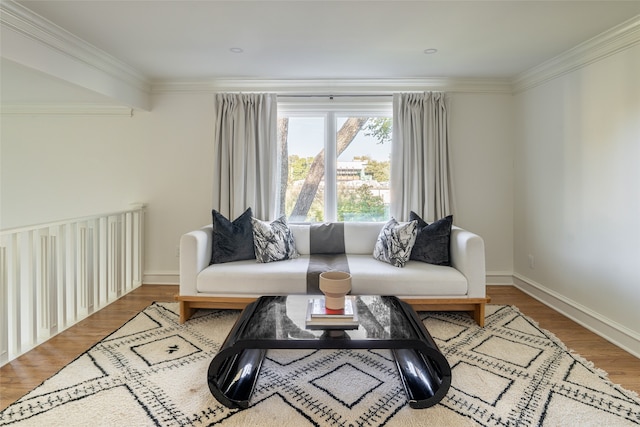 living room with crown molding and hardwood / wood-style flooring