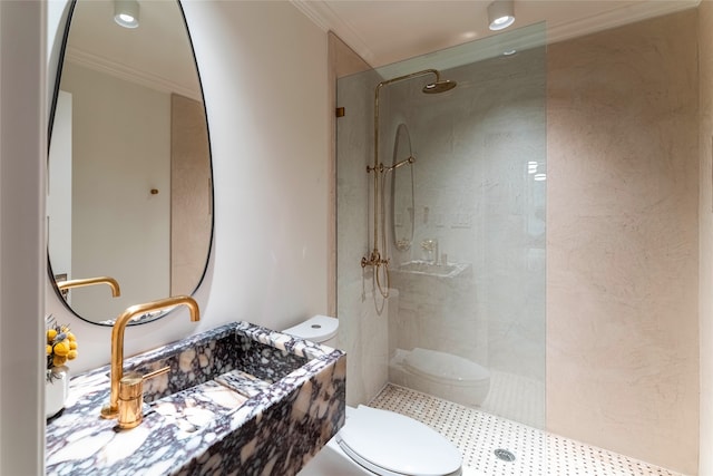 bathroom with toilet, a shower, and ornamental molding