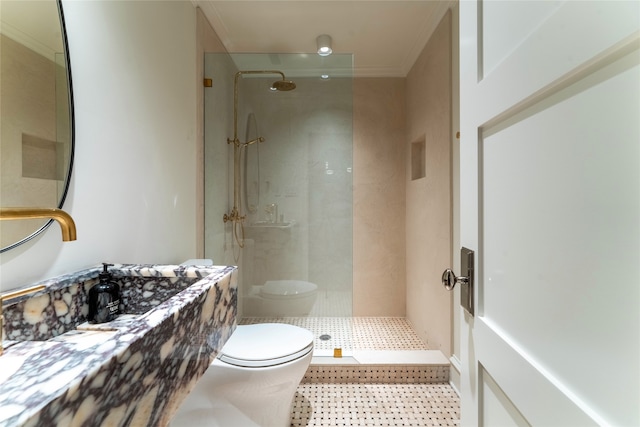 bathroom with toilet, crown molding, and walk in shower