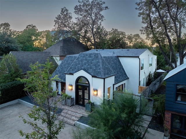 view of front of property with french doors and central air condition unit