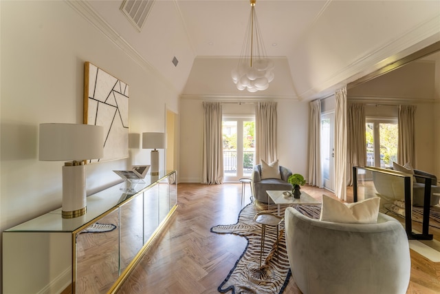 sitting room featuring light parquet flooring, ornamental molding, vaulted ceiling, and a notable chandelier