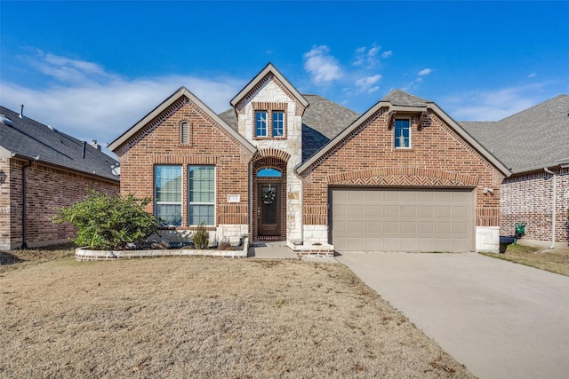 view of front property with a front yard and a garage