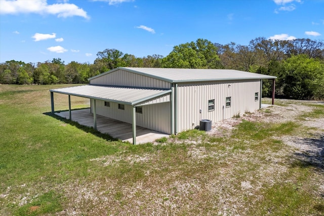 view of outbuilding with a lawn