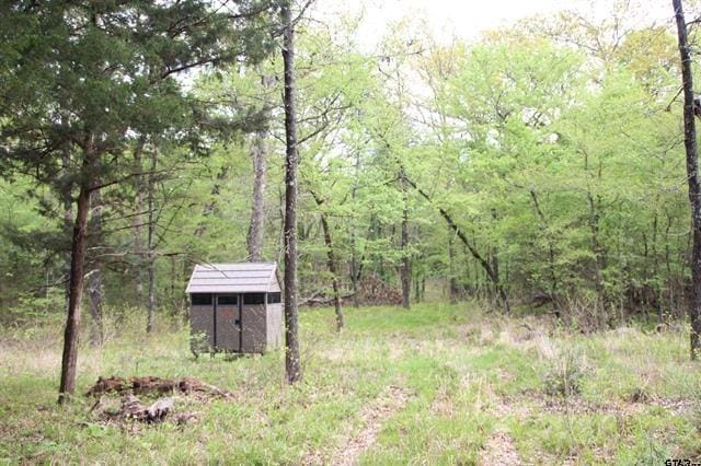 exterior space with a storage shed