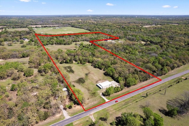 birds eye view of property featuring a rural view