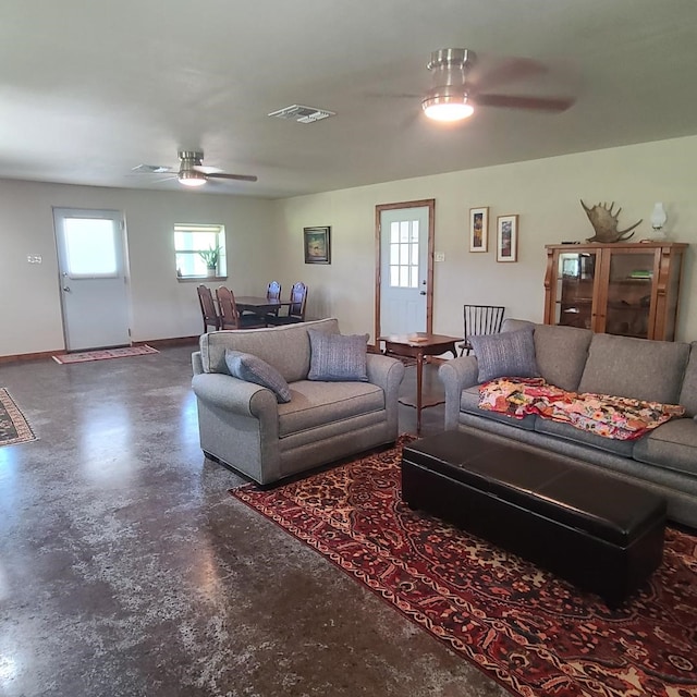 living room featuring concrete floors and ceiling fan