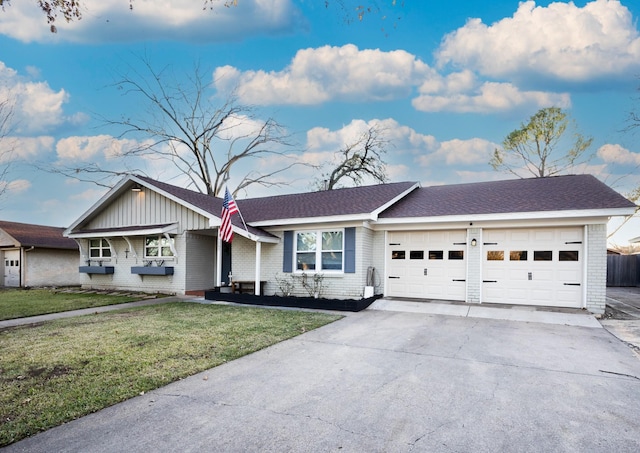 ranch-style home featuring a front lawn and a garage