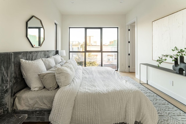 bedroom with hardwood / wood-style floors