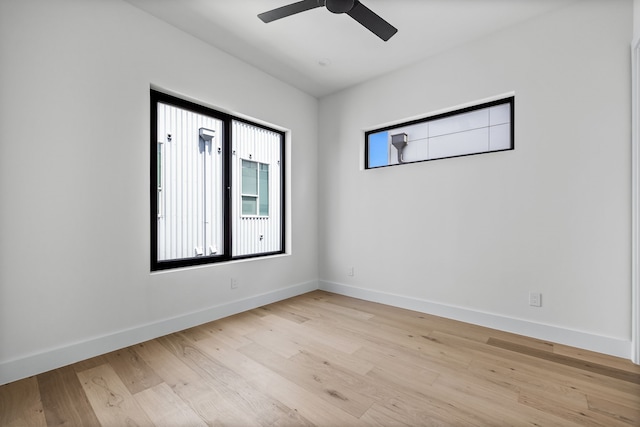 empty room featuring ceiling fan and light wood-type flooring