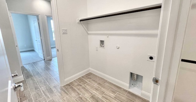 clothes washing area with washer hookup, gas dryer hookup, and electric dryer hookup