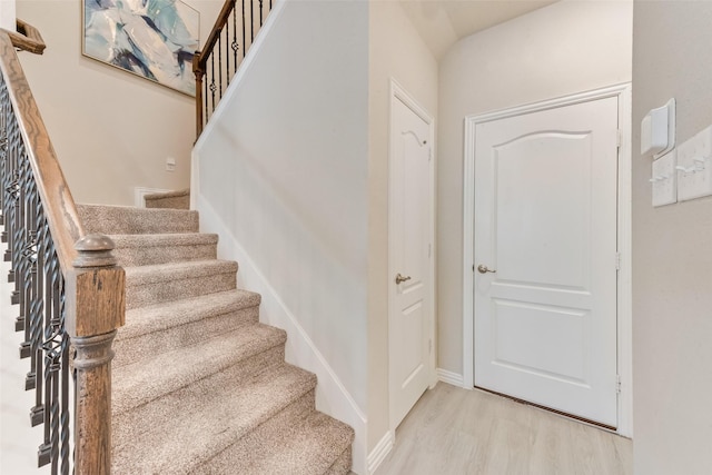 stairway with wood-type flooring