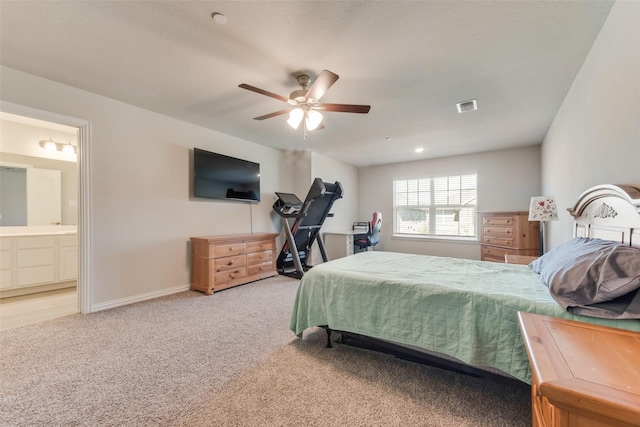 carpeted bedroom featuring connected bathroom and ceiling fan