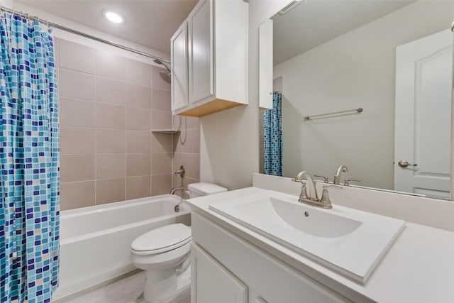 full bathroom featuring vanity, shower / bathtub combination with curtain, and toilet