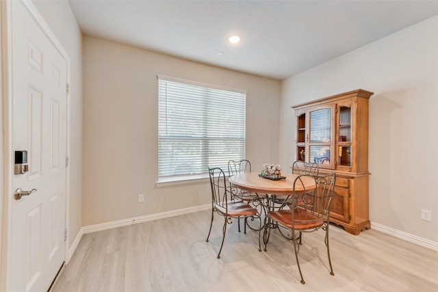 dining space featuring light wood-type flooring