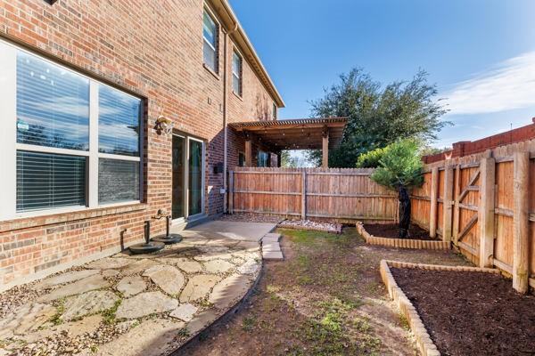 view of yard with a pergola and a patio