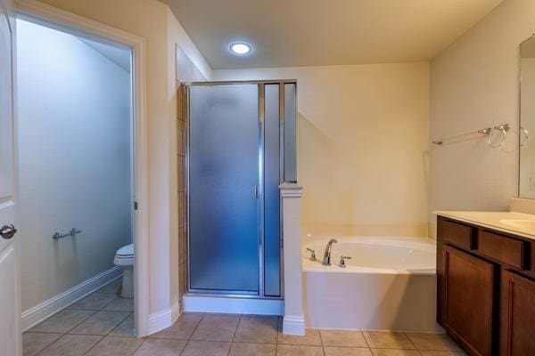 full bathroom featuring vanity, tile patterned floors, and shower with separate bathtub