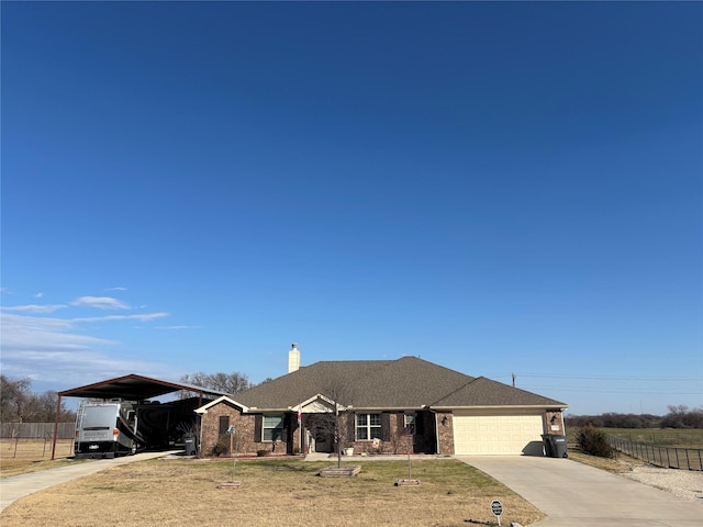 view of front of house featuring a front yard and a garage