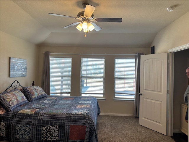 bedroom with ceiling fan, carpet, and lofted ceiling