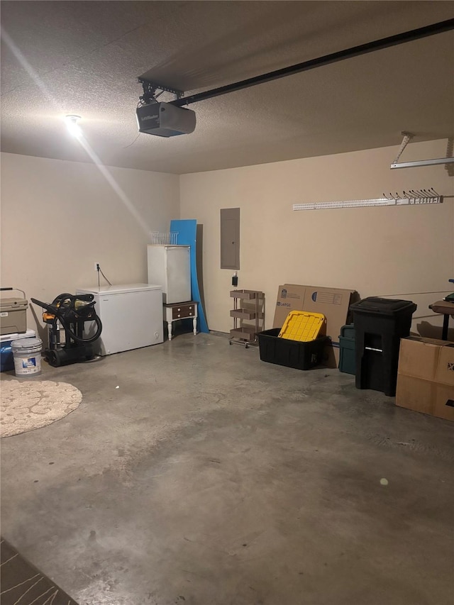 garage featuring a garage door opener, electric panel, and refrigerator