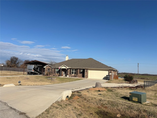 ranch-style house with a front yard, a garage, and a carport