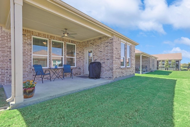 exterior space with ceiling fan and a patio