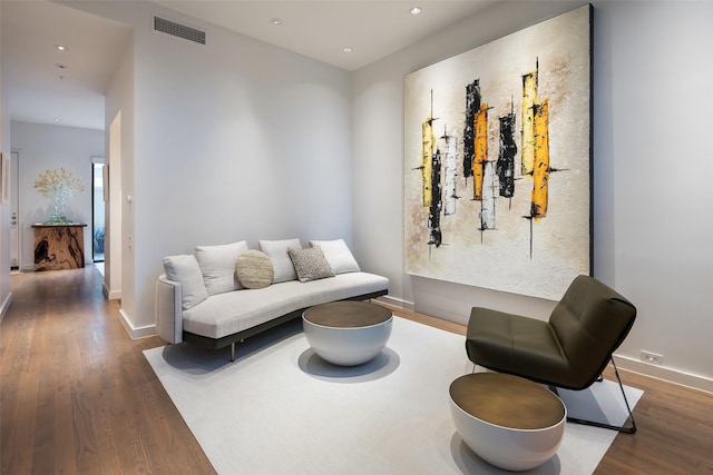 living area with dark hardwood / wood-style floors