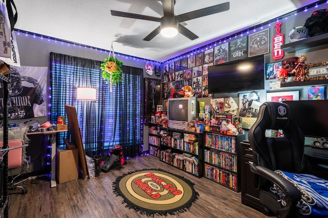 rec room featuring hardwood / wood-style flooring and ceiling fan