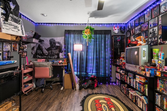 office with wood-type flooring and a textured ceiling