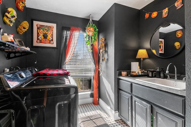 laundry area featuring sink and washing machine and clothes dryer