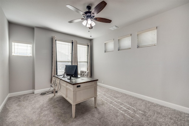 office featuring ceiling fan and light colored carpet