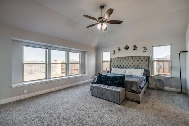 bedroom featuring ceiling fan, lofted ceiling, carpet floors, and multiple windows