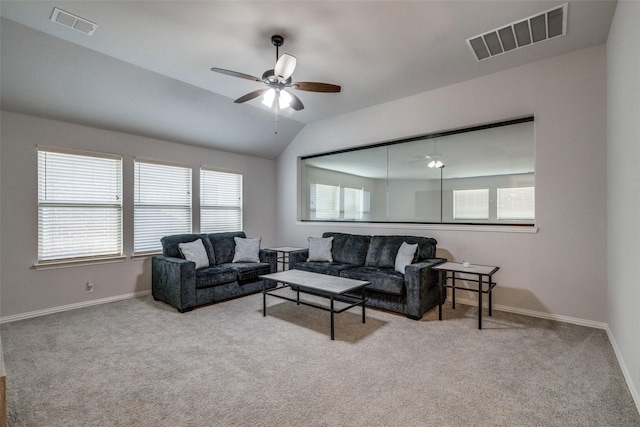 carpeted living room featuring ceiling fan and lofted ceiling