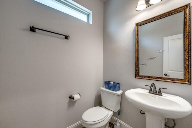 bathroom featuring toilet and sink