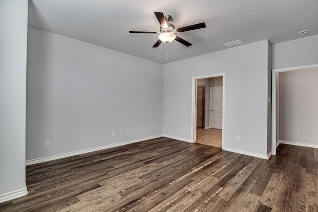 unfurnished bedroom featuring ceiling fan and dark hardwood / wood-style floors