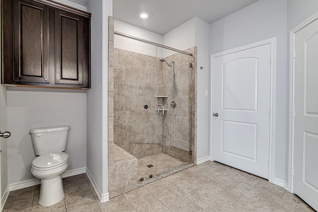 bathroom with toilet and an enclosed shower