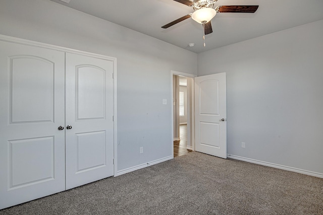 unfurnished bedroom featuring a closet, ceiling fan, and carpet