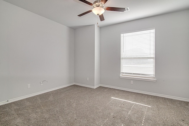 spare room with ceiling fan and carpet flooring