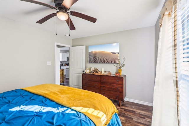 bedroom featuring ceiling fan and dark wood-type flooring