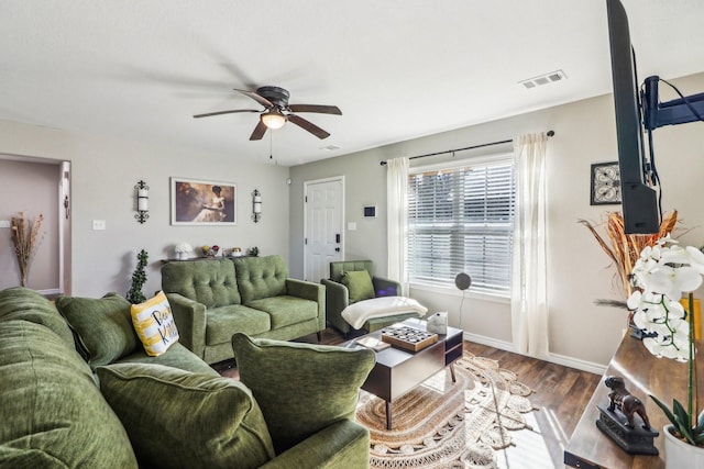 living room featuring ceiling fan and wood-type flooring