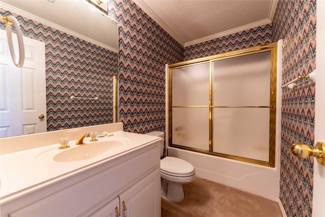 full bathroom featuring toilet, a textured ceiling, bath / shower combo with glass door, ornamental molding, and vanity